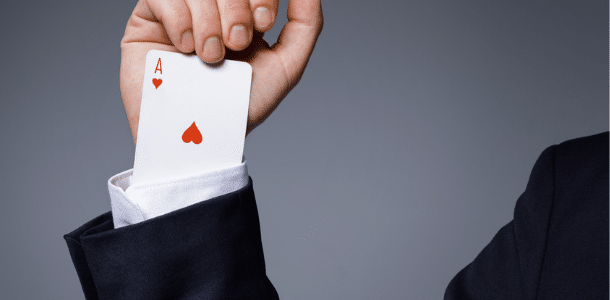 Person with card up their sleeve