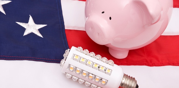 an American flag, a piggy bank, and an LED bulb